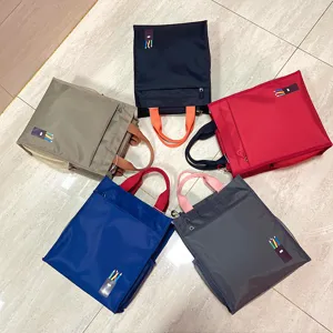 Detail view of multi-layer thickened color-blocked student tote bag for daily commuting.