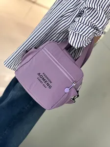 Stylish purple insulated lunch bag and crossbody tote for women daily commute and bento storage.