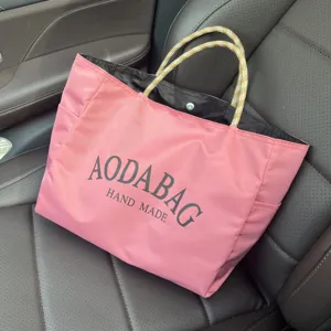 Pink canvas tote bag detail, large capacity casual handbag with braided rope handles.