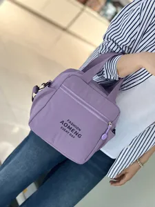 Waterproof insulated lunch bag tote crossbody bag for women daily commuting bento use.