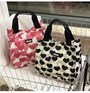 Canvas lunch bag with cute heart print, portable hand tote bag for daily meal prep and storage.
