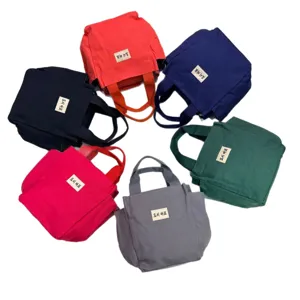 Solid canvas mini tote bag, casual handbag and lunch pouch in multiple vibrant colors.