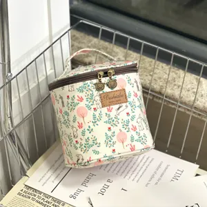 Portable bucket cosmetic bag waterproof lunch storage bag with cute print and zipper closure.