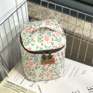 Waterproof cute bunny floral cosmetic bag and lunch storage container with carry handle.