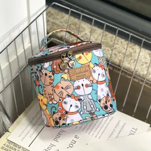 Waterproof cartoon cat print cosmetic bag with zipper and top handle for portable daily storage.