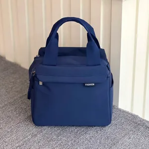 Waterproof insulated lunch bag detail view, solid color large capacity handbag for women.