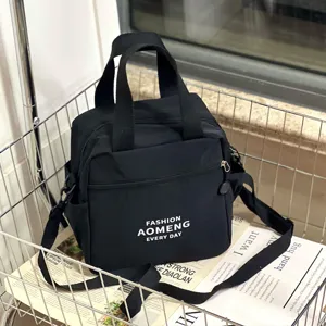 Crossbody waterproof insulated lunch bag with cup holder, daily commute tote bag for women.