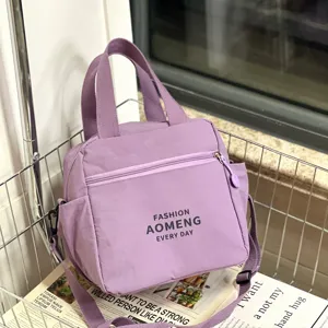 Purple waterproof insulated lunch handbag with shoulder strap, casual daily tote bag detail view.