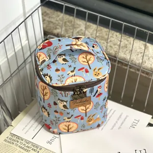 Cute woodland animal print insulated lunch bag and cosmetic storage bucket for daily use.