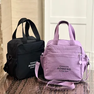 Waterproof insulated lunch bag with strap, portable dual-use bento tote for daily work and school.