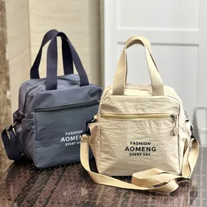 Waterproof insulated lunch bag, dual-use tote and crossbody shoulder bag for commuting.