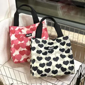 Canvas lunch bag with cute heart pattern, stylish contrast color tote for daily use.