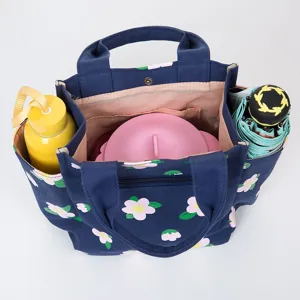 Navy blue floral canvas lunch tote bag with multiple compartments for daily student use.