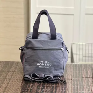 Waterproof insulated lunch bag with shoulder strap, commuter crossbody tote bag for women daily use.