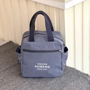 Grey waterproof insulated lunch bag detail, featuring durable fabric for daily commute.