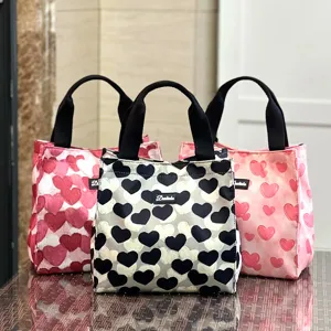 Large capacity portable canvas lunch bag with stylish heart print, ideal for daily office use.