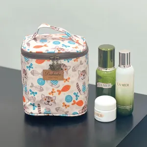 Detailed view of the cute cat print cosmetic bag with convenient handle and zipper closure.