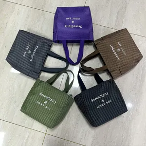 Stylish plaid canvas tote bag, large capacity shoulder handbag for daily commuting use.