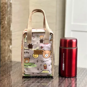 Cute cartoon bear print insulated lunch bag with sturdy handles, perfect for daily use.