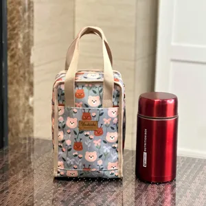 Insulated lunch bag with cute bear floral print, waterproof bento handbag for work school.