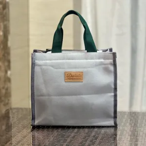 Borsa per pranzo in tela semplice, grande capacità bento borsetta, grigio con manici verdi.