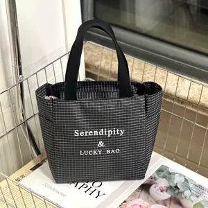 Black and white grid tote bag with white letter print, casual daily commuter handbag.