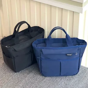 Waterproof multi-pocket canvas lunch bag large capacity tote bag for daily commute and travel.