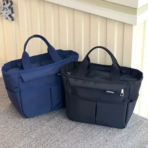 Waterproof multi-pocket lunch bag with large capacity tote design for daily commute.