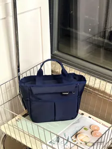 Waterproof multi-pocket lunch handbag detail shot, durable blue bento tote bag for commute.