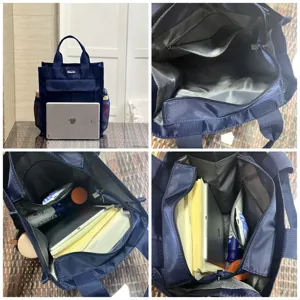 Detail view of large capacity multi-pocket navy blue canvas tote bag and document bag for daily use.