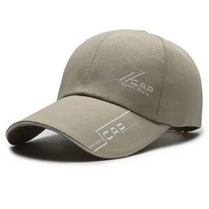 Detailed view of the long brim baseball cap in khaki fabric with sport style print.