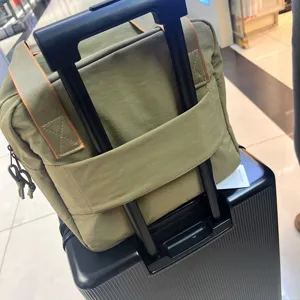 Sac de voyage vert avec manchon pour valise, sac d'affaires Oxford résistant pour voyage.
