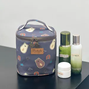 Waterproof cosmetic bag with cute cartoon bear and rainbow print, portable lunch storage bag.