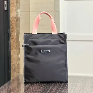 Large color-block lunch bag tote handbag for student worker and daily commuting use.