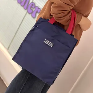 Large color block tote lunch bag for students and office workers, portable bento storage bag.