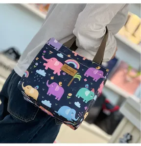 Cute cartoon elephant print insulated lunch bag, portable small thermal tote for daily use.