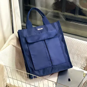 Large capacity multi-pocket tote document bag, durable waterproof blue handbag for daily use.