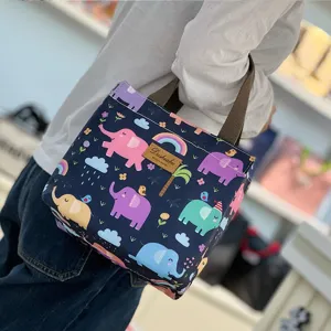 Cute waterproof cartoon insulated lunch bag, portable thermal bento handbag for daily commuting.