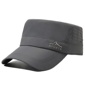 Detail view of the dark grey quick-dry flat-top cap featuring side laser ventilation holes.