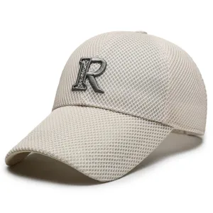 Detailed view of the beige mesh baseball cap featuring a bold 3D embroidered letter R front.