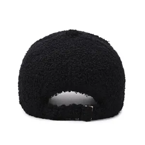 Rear detail view of black teddy fleece baseball cap with adjustable metal buckle strap.