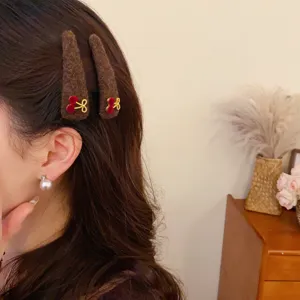 Brown plush hair clips with cute bow and cherry details, ideal for autumn winter daily wear.