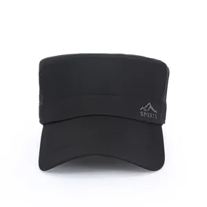 Close up view of the black quick-dry flat top outdoor cap, showing mountain logo detail.