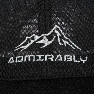 Detailed view of men's breathable mesh baseball cap with mountain embroidery and logo design.