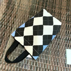 Canvas tote bag with classic argyle pattern, ideal for daily commuting and carrying small items.