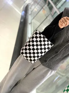 Black and white checkerboard canvas tote bag, stylish mini handbag for daily use and cups.