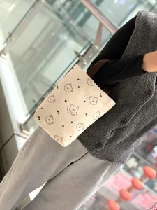 Canvas tote bag featuring cute bear print, minimalist casual handbag for daily office.