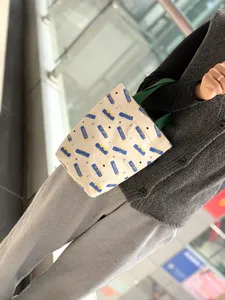 Minimalist canvas tote bag with cute printed pattern, durable portable cup bag for daily use.