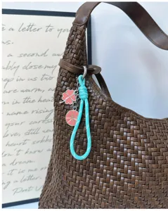 Leuke klaver citrusvrucht gevlochten lanyard bedel, veelzijdige tas hanger en stijlvolle sleutelhanger.