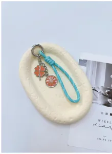 Leuke klaverblad en sinaasappel sleutelhanger tas hanger stijlvol en uniek mode accessoire